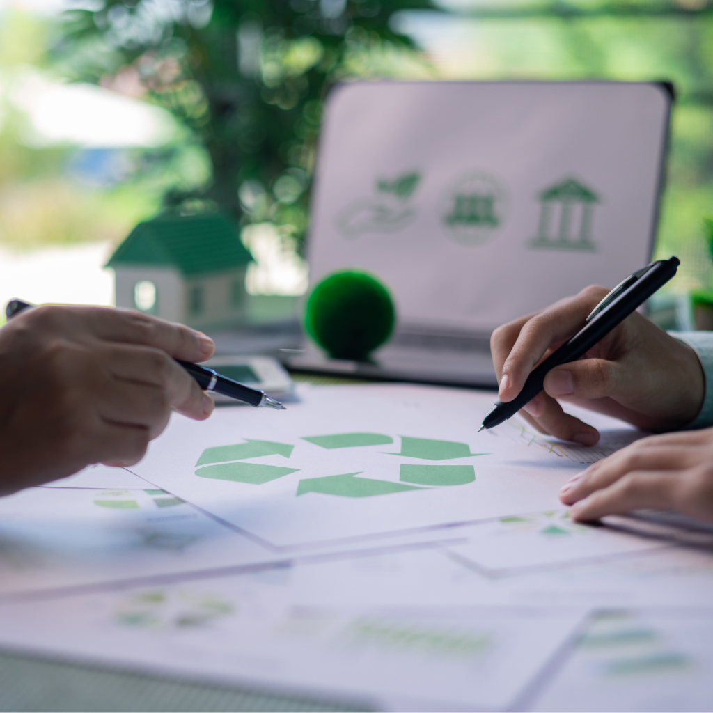 two and holding pen and papers .