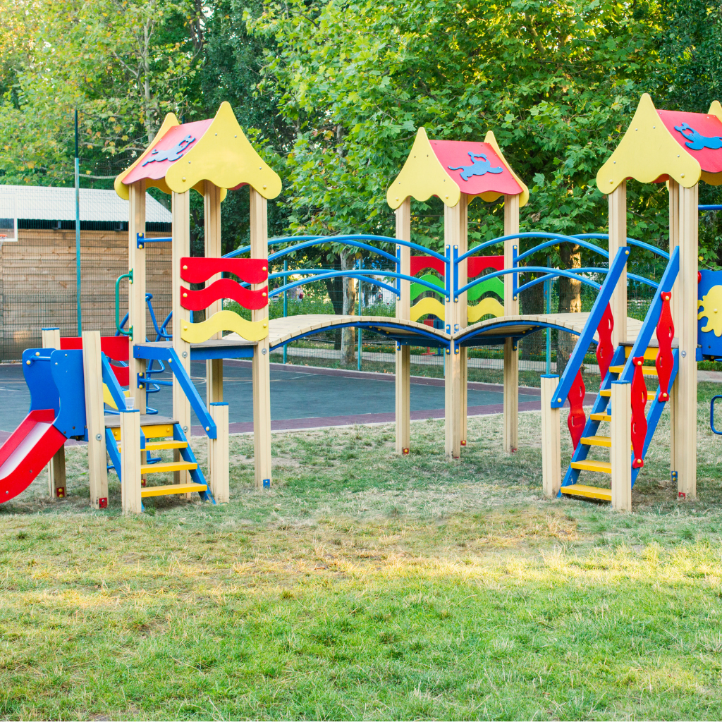 kids playing area , trees , grass.